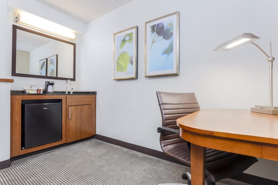 Premium bedding, desk, laptop workspace, blackout drapes