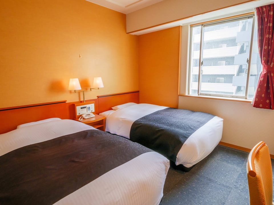 Down comforters, desk, WiFi (free), bed sheets