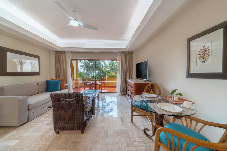 One Bedroom Suite | Living area | 42-inch plasma TV with cable channels