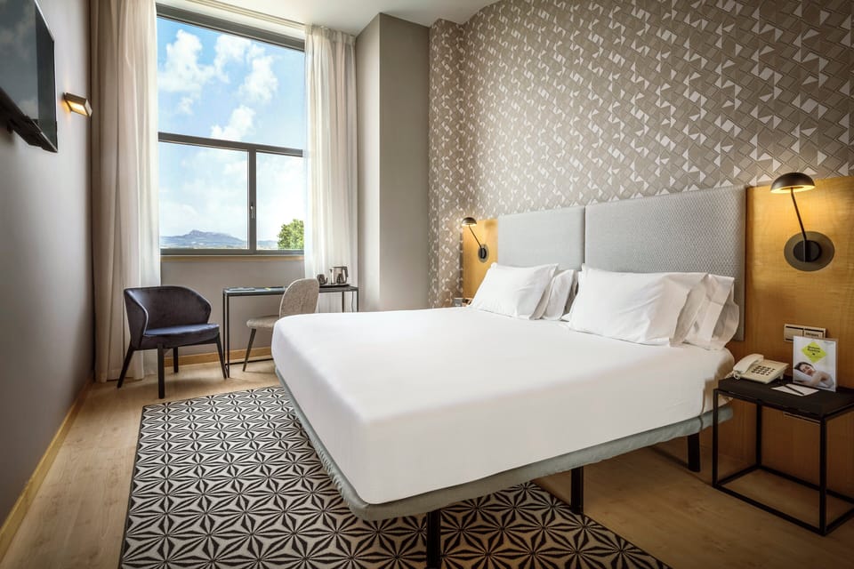 Junior Double Room | Minibar, in-room safe, desk, iron/ironing board