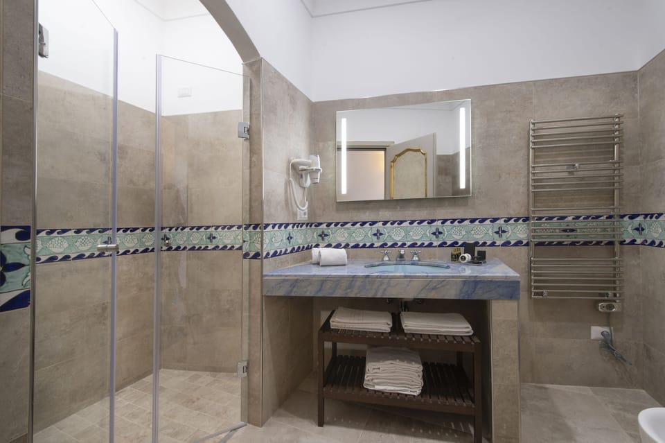 Triple Room, Sea View (French Balcony) | Bathroom | Combined shower/tub, free toiletries, hair dryer, bathrobes