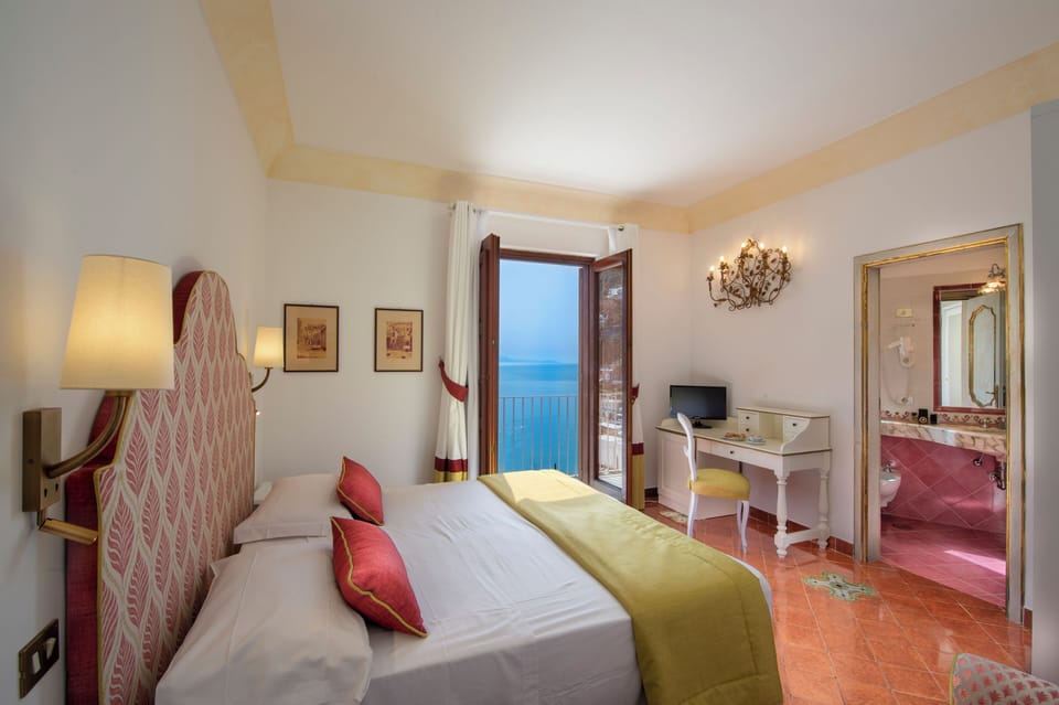 Standard Double Room, Sea View (French Balcony) | Minibar, in-room safe, desk, laptop workspace