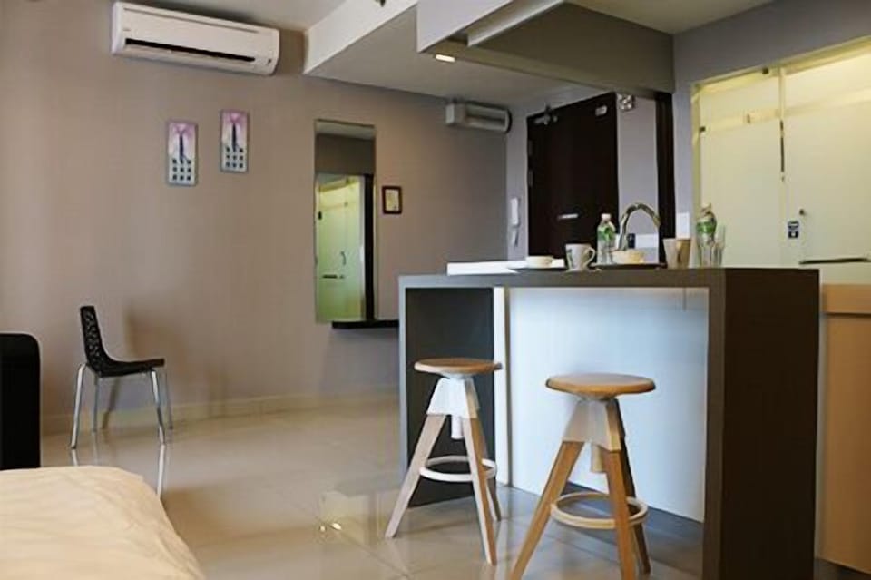 Fridge, electric kettle, cleaning supplies