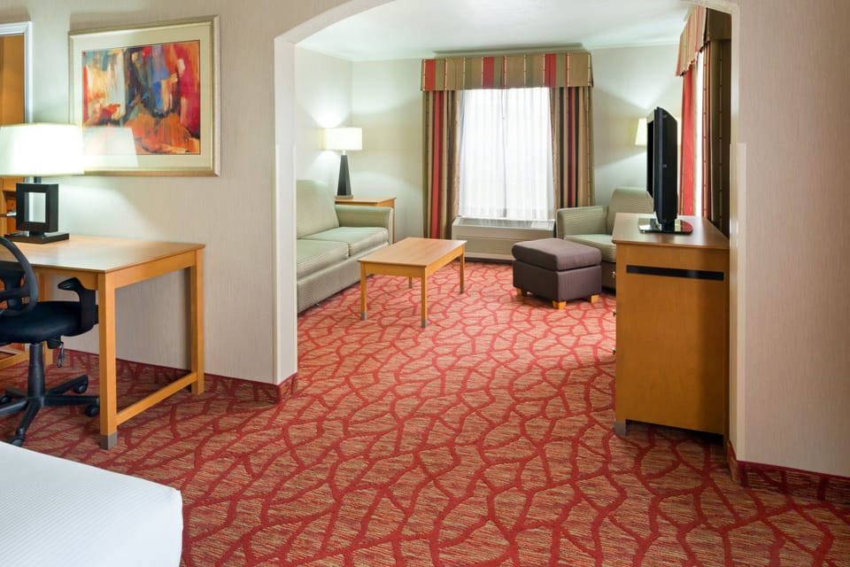 Suite, 1 King Bed (Additional Living Area) | In-room safe, desk, iron/ironing board, free cribs/infant beds