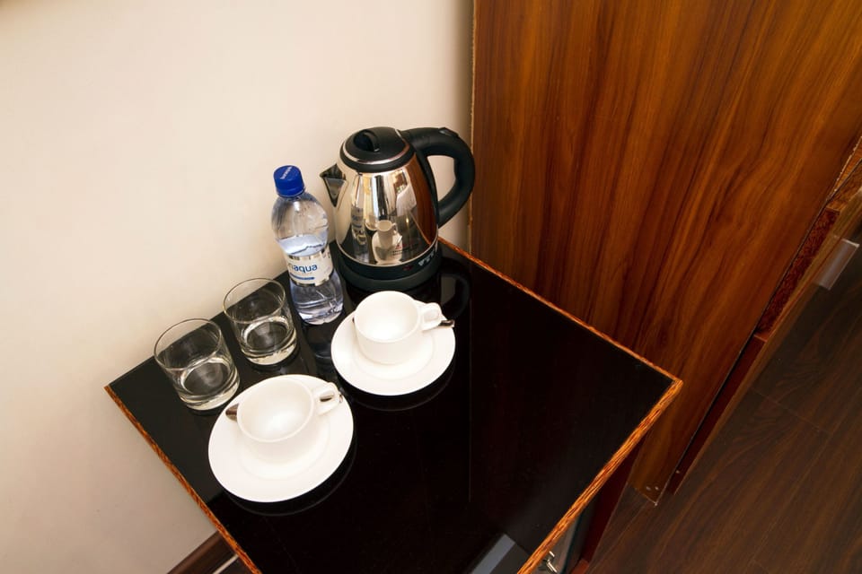 Deluxe Triple Room | Coffee and/or coffee maker