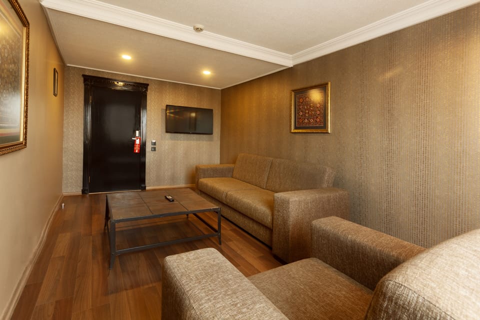 Basic Suite, 1 Queen Bed | Living area | 32-inch LED TV with satellite channels, TV