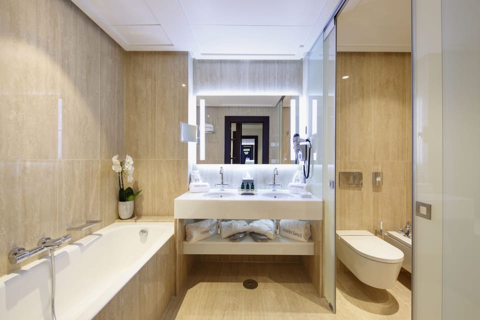 Separate tub and shower, eco-friendly toiletries, hair dryer, bathrobes