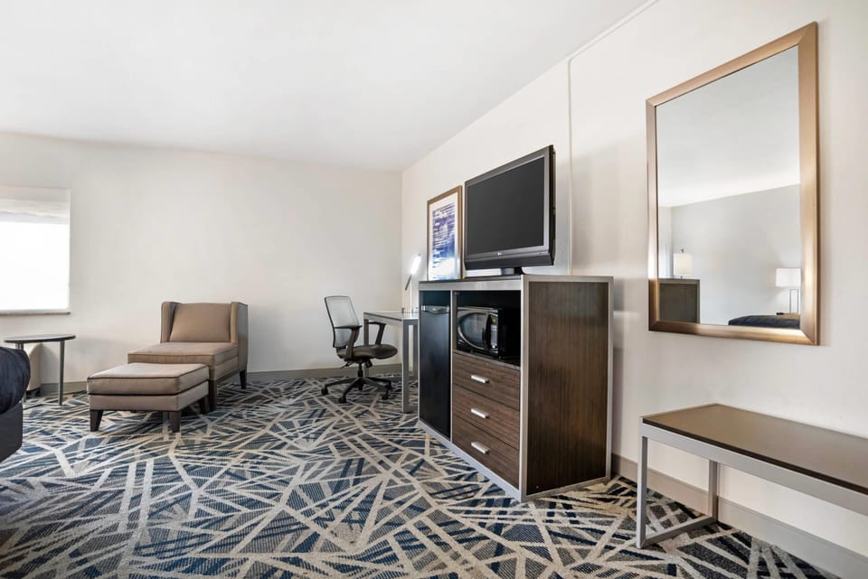 Desk, laptop workspace, blackout drapes, iron/ironing board