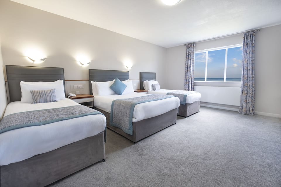 Family Quadruple Room | Iron/ironing board, free cribs/infant beds, free WiFi, bed sheets