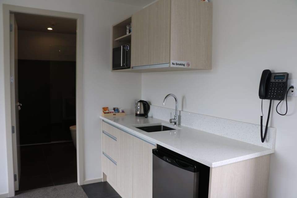 Executive Room, 1 Bedroom, Refrigerator & Microwave (First Floor) | Private kitchenette | Coffee/tea maker, fridge, microwave, electric kettle