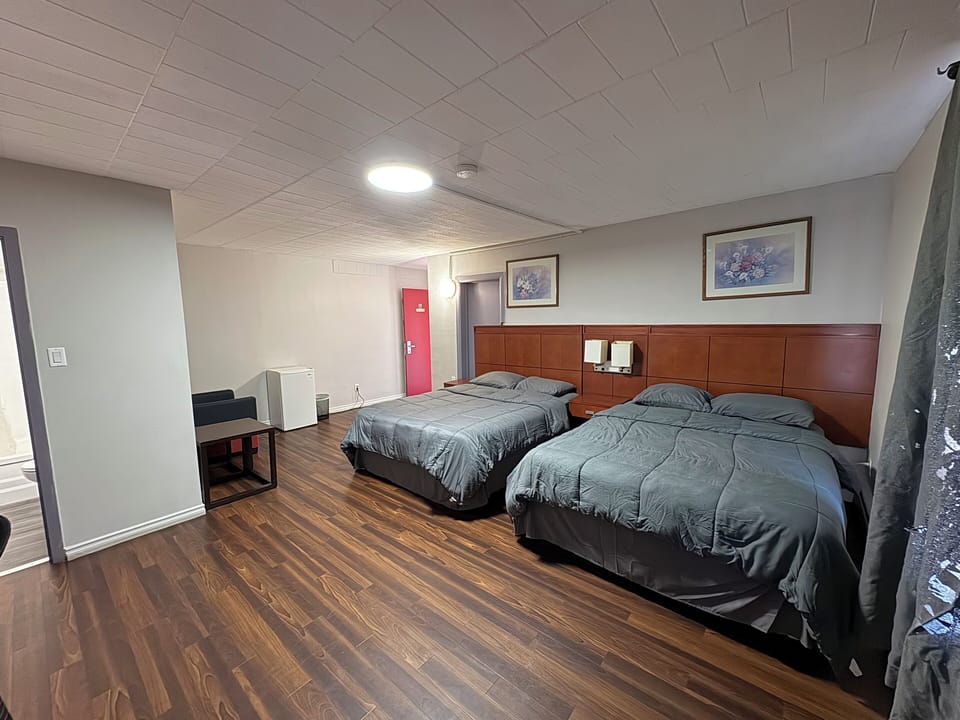 Standard Room, 2 Queen Beds | Individually decorated, individually furnished, desk, laptop workspace