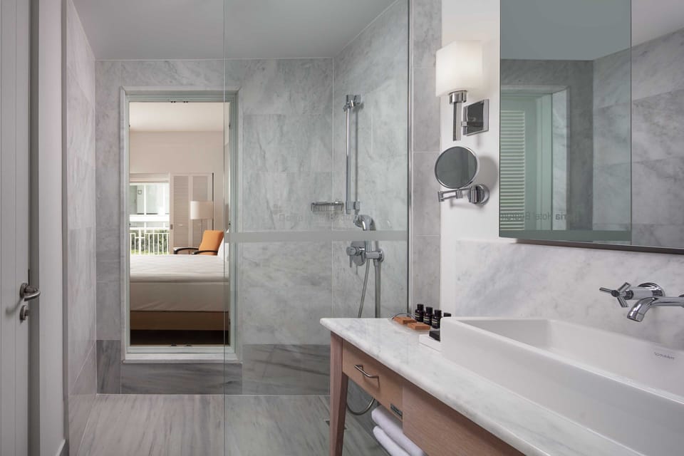 Designer toiletries, hair dryer, bathrobes, slippers