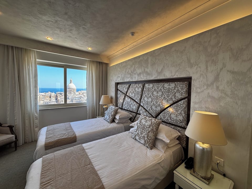 Deluxe Room, Sea View | Minibar, in-room safe, individually decorated, individually furnished