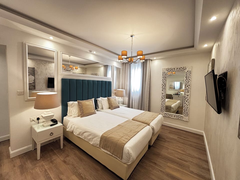 Double or Twin Room | Minibar, in-room safe, individually decorated, individually furnished