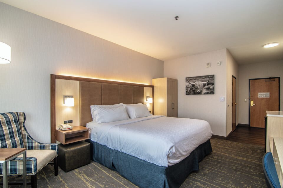 Premium bedding, desk, laptop workspace, blackout drapes