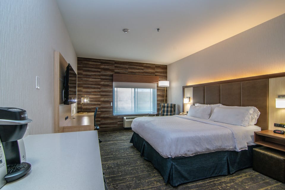 Premium bedding, desk, laptop workspace, blackout drapes