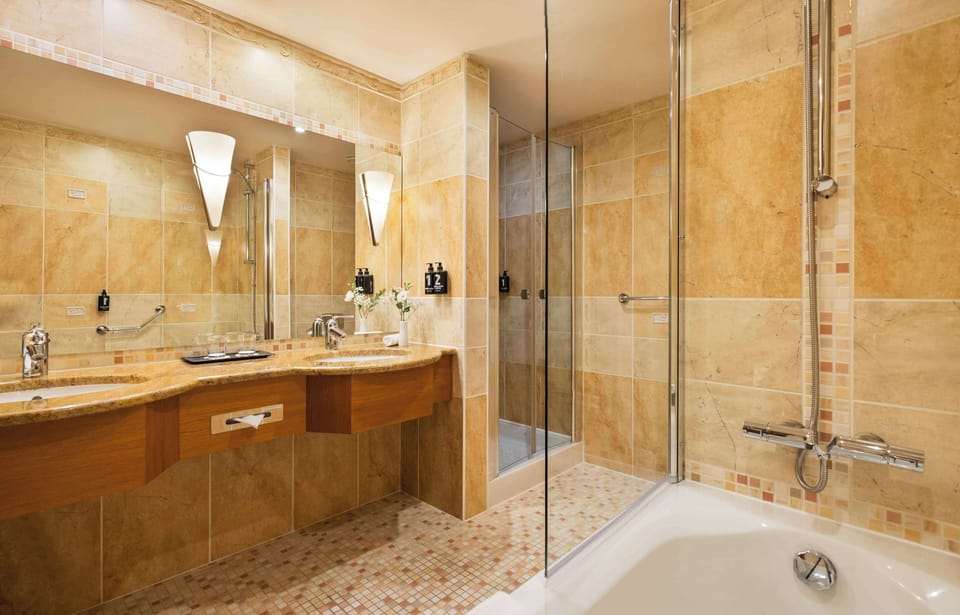 Suite, 1 Bedroom | Bathroom | Eco-friendly toiletries, hair dryer, slippers, heated floors
