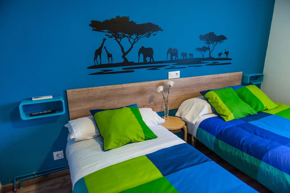 Family Room | Desk, blackout drapes, free WiFi, bed sheets