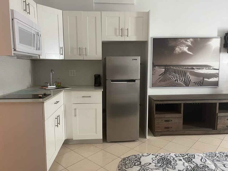 Partial Beach View 60 | Private kitchen | Fridge, microwave, stovetop, coffee/tea maker