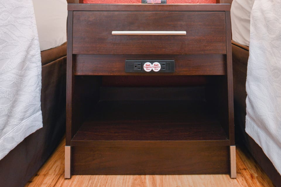 Desk, iron/ironing board, cribs (free), WiFi (free)