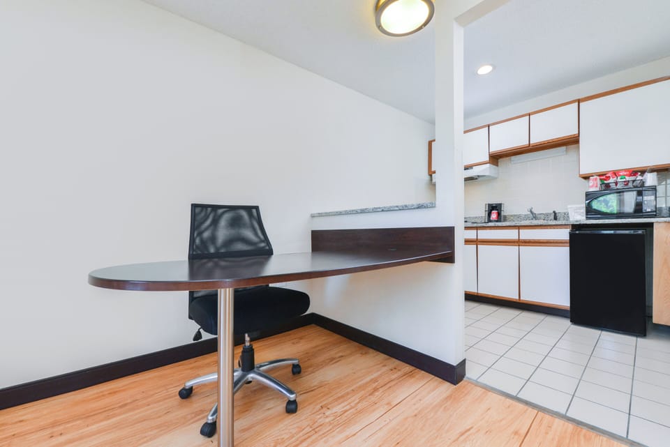 Desk, iron/ironing board, cribs (free), WiFi (free)