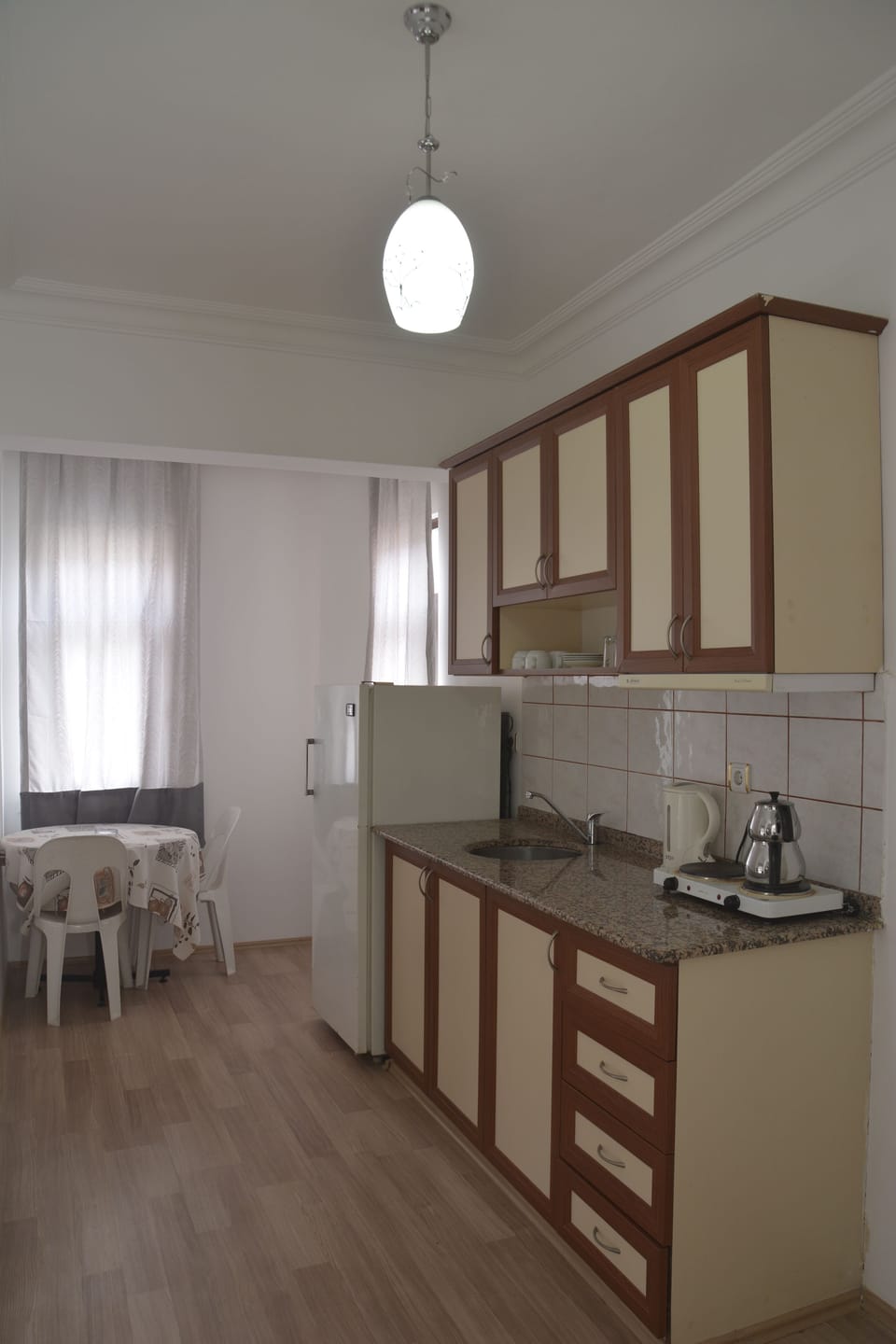 Apartment, 1 Bedroom | Private kitchenette | Fridge, stovetop, electric kettle, cookware/dishes/utensils