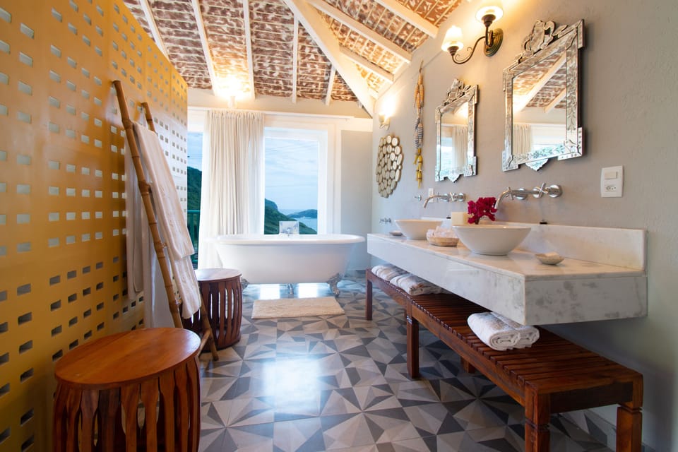 Premier Suite, 1 King Bed, Hot Tub, Partial Ocean View | Bathroom | Hair dryer, towels, soap, toilet paper