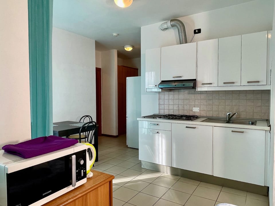 Apartment, Ground Floor | Private kitchen | Fridge, stovetop, electric kettle, cookware/dishes/utensils