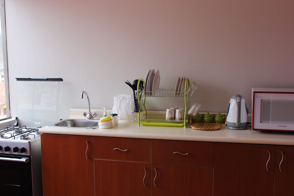 Full-size fridge, microwave, stovetop, coffee/tea maker