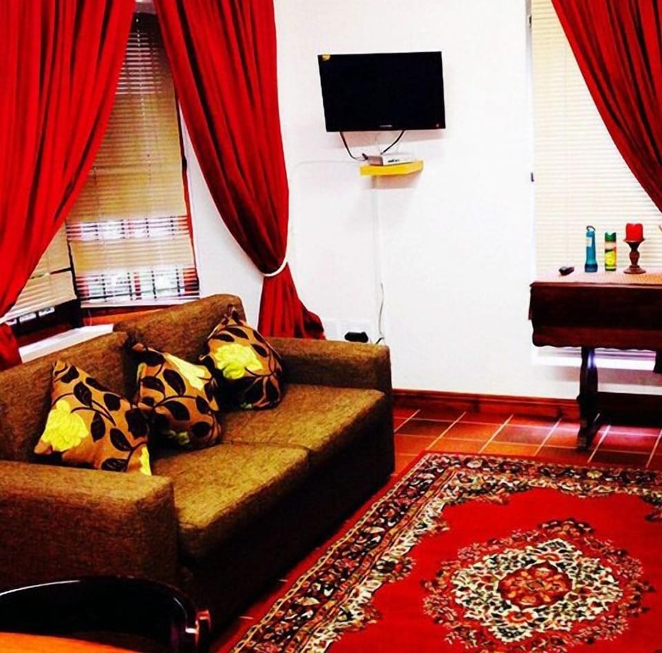 Apartment, 1 Bedroom | Living area | TV