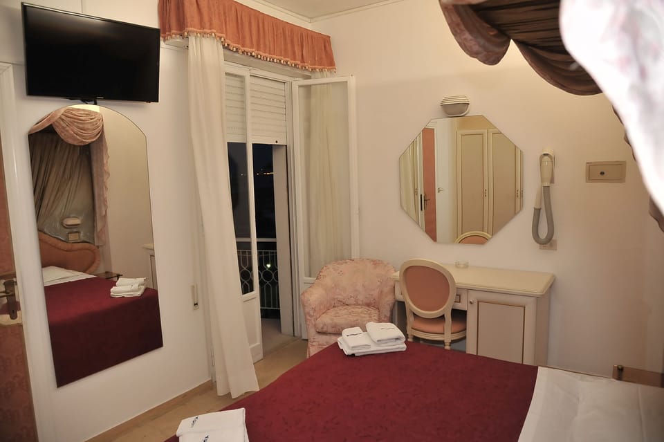 Quadruple Room, Balcony | In-room safe, desk, WiFi (free), bed sheets