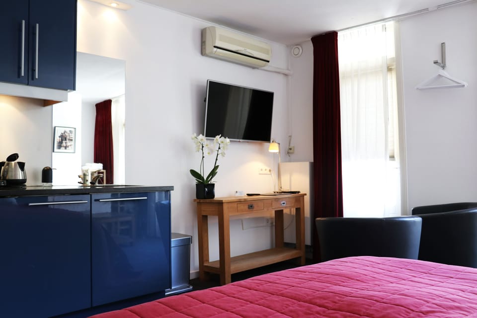 Room with Balcony | Free minibar, in-room safe, desk, laptop workspace
