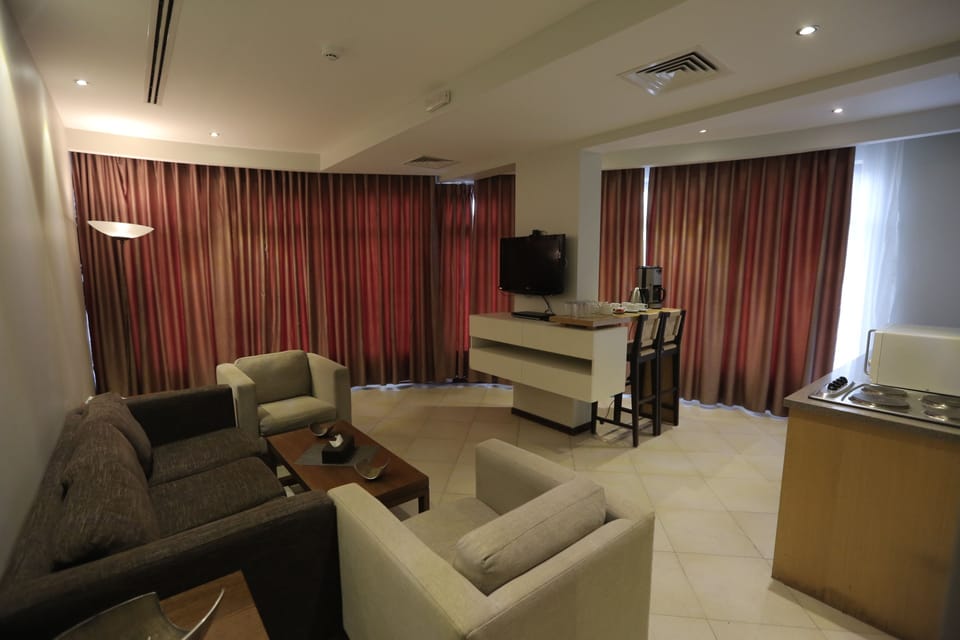 Royal Apartment, 2 Bedrooms, Kitchenette, City View | Living room | 32-inch flat-screen TV with satellite channels, TV