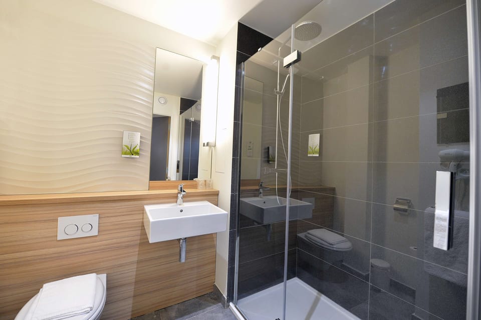 Shower, eco-friendly toiletries, hair dryer, towels