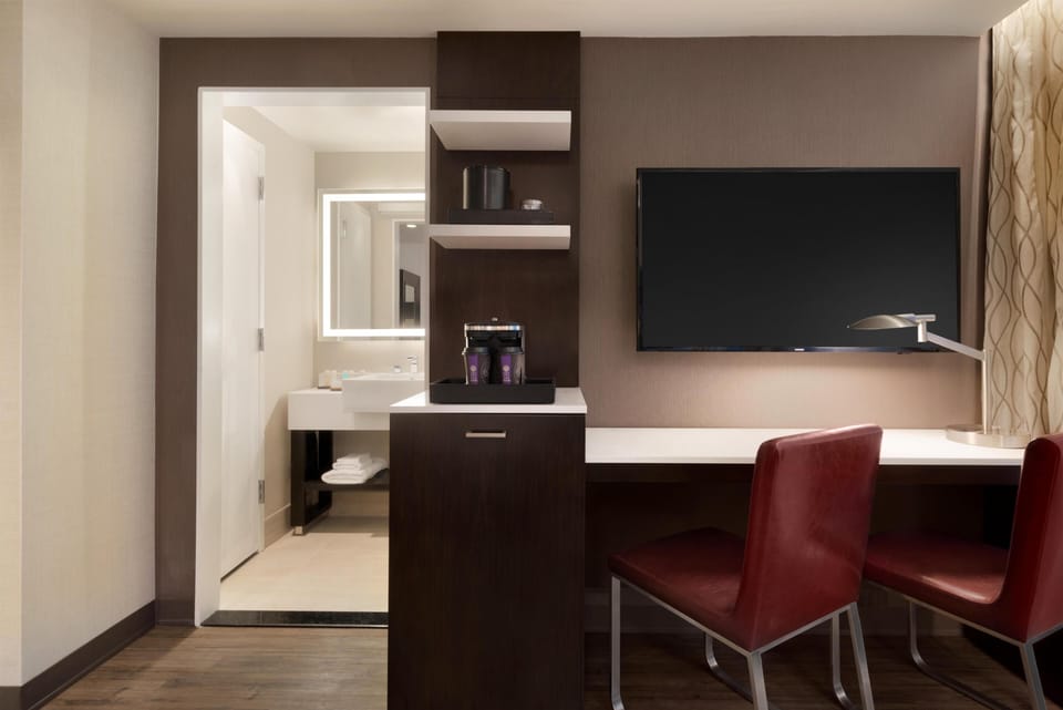 Premium bedding, down comforters, pillowtop beds, in-room safe