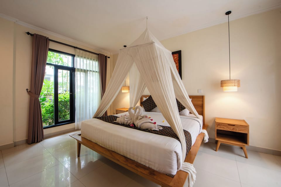 Deluxe Garden Villa | Minibar, in-room safe, desk, free cribs/infant beds