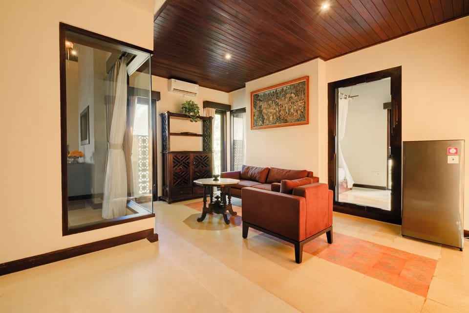 Two Bedroom Villa with Butler Service | Living area | 42-inch TV with cable channels, DVD player