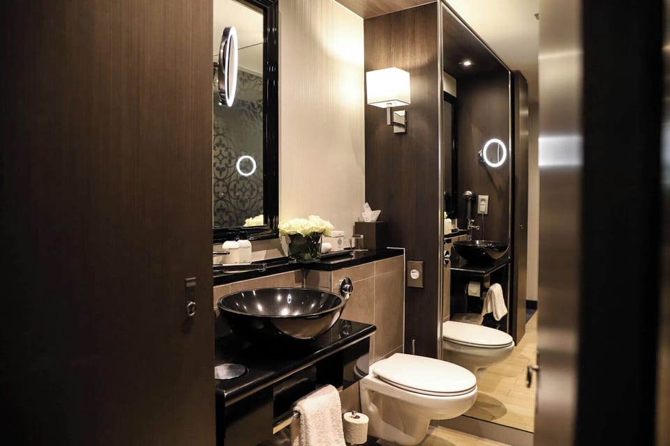 Courtyard room | Bathroom | Designer toiletries, hair dryer, bathrobes, slippers