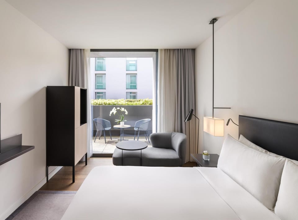 Deluxe Room, 1 King Bed, Balcony | Living area | 30-inch flat-screen TV with digital channels, TV