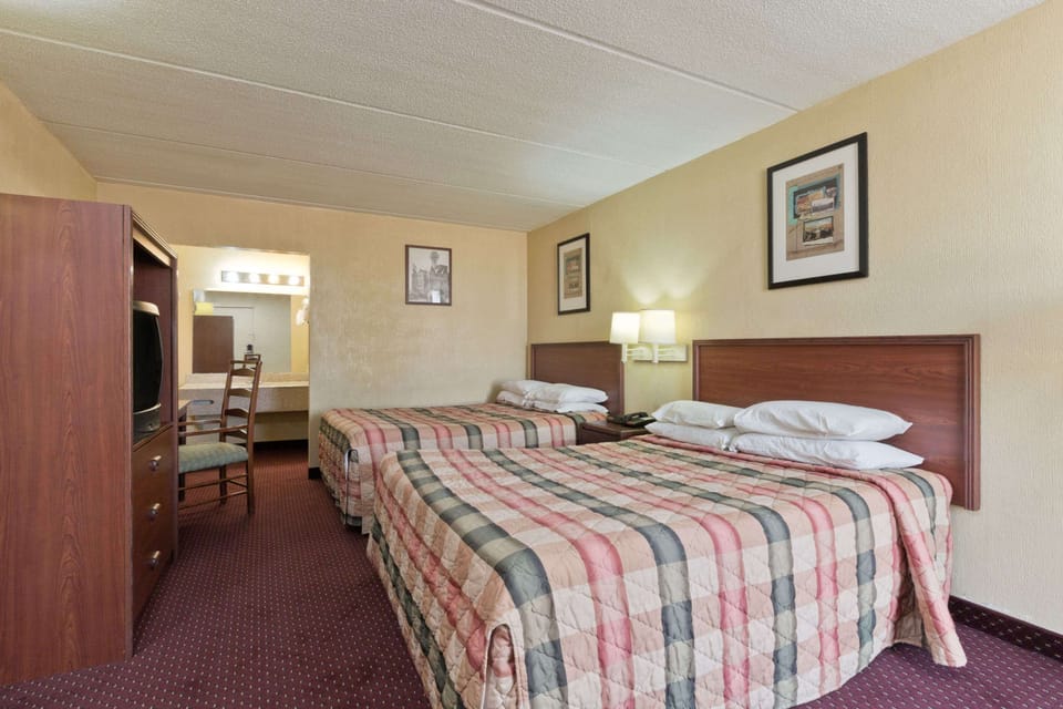 Room, 2 Double Beds | Iron/ironing board, cribs (free), WiFi (free), alarm clocks