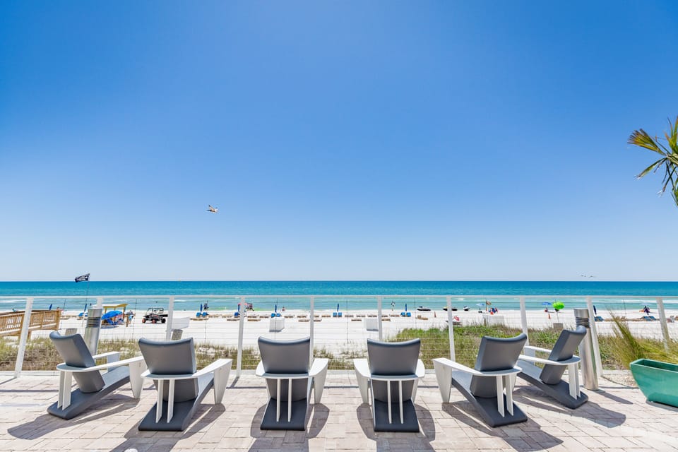 On the beach, white sand, sun loungers, beach umbrellas