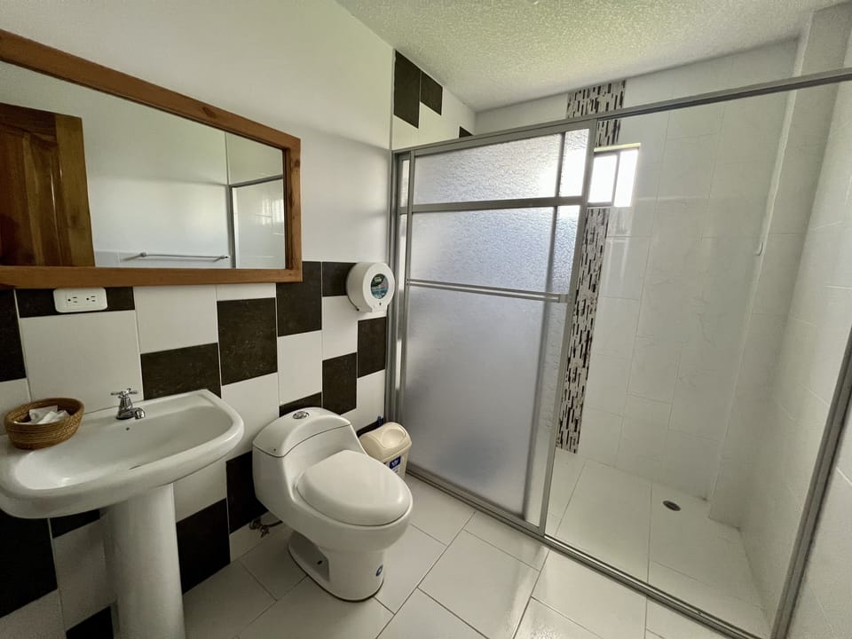 Family Triple Room | Bathroom | Combined shower/tub, free toiletries, hair dryer, towels