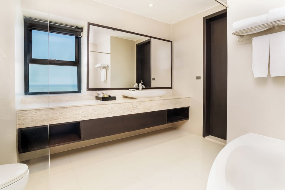 Premium Room, 2 Bedrooms, Partial Sea View | Bathroom | Shower, free toiletries, hair dryer, bathrobes
