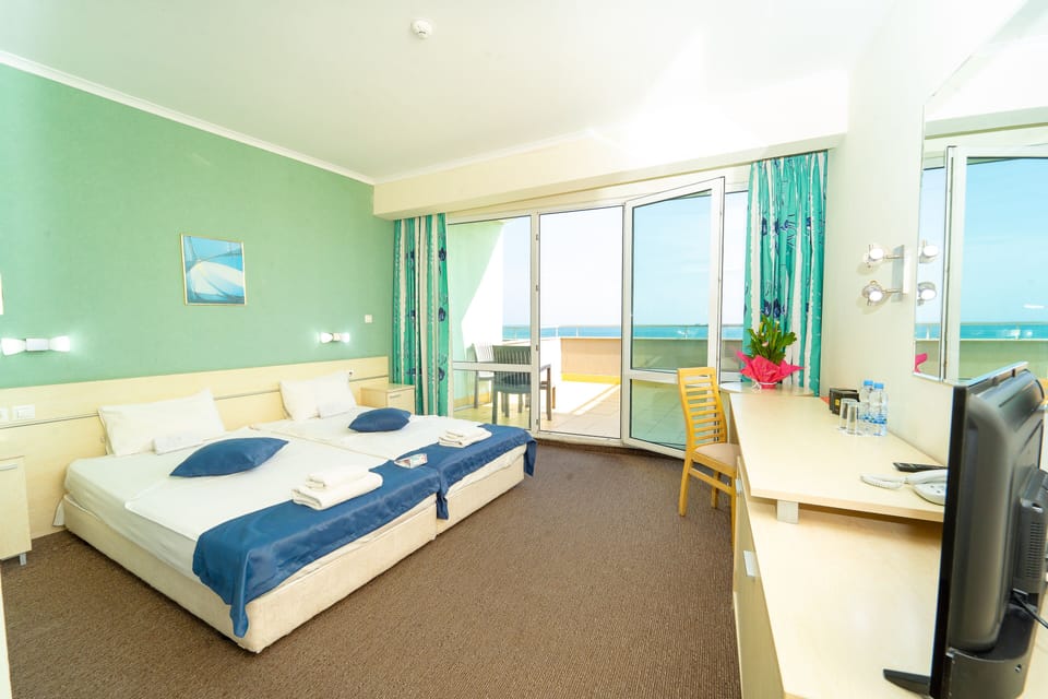 Double or Twin Room | Desk, blackout drapes, iron/ironing board, free cribs/infant beds
