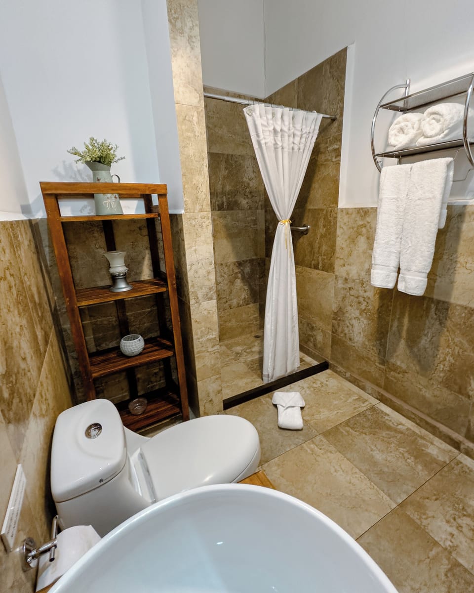Design Room | Bathroom | Separate tub and shower, rainfall showerhead, free toiletries, towels