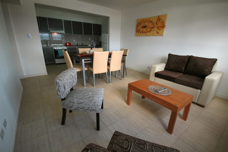 Grand Apartment, 2 Bedrooms, Sea View | Living area | Flat-screen TV, books