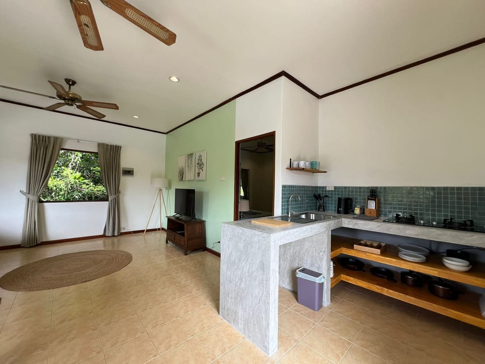 Family Apartment with Garden View | Living area | 32-inch LED TV with digital channels