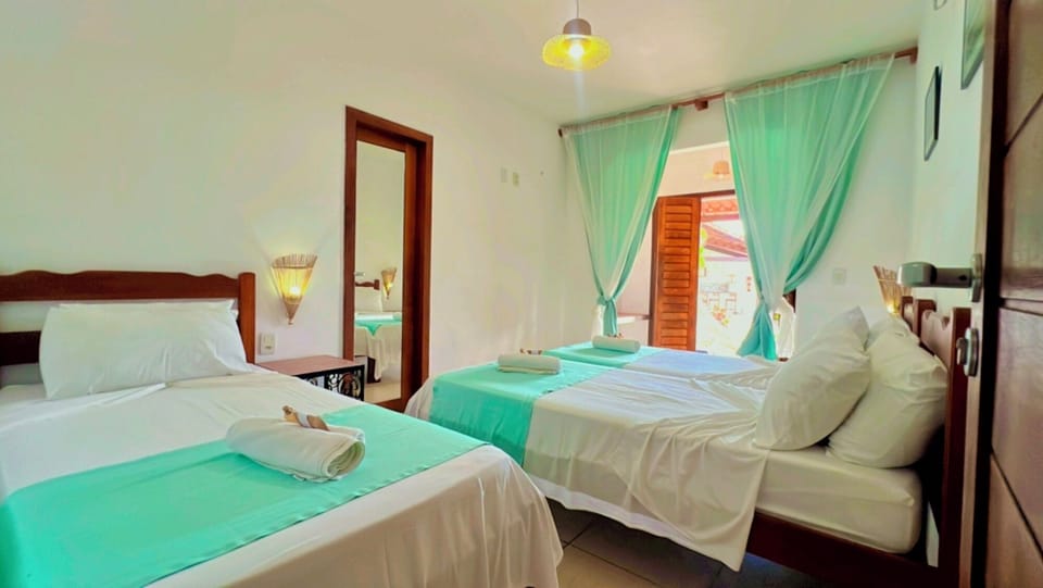 Deluxe Triple Room, 1 Bedroom, Garden View, Ground Floor | Premium bedding, minibar, individually decorated, individually furnished