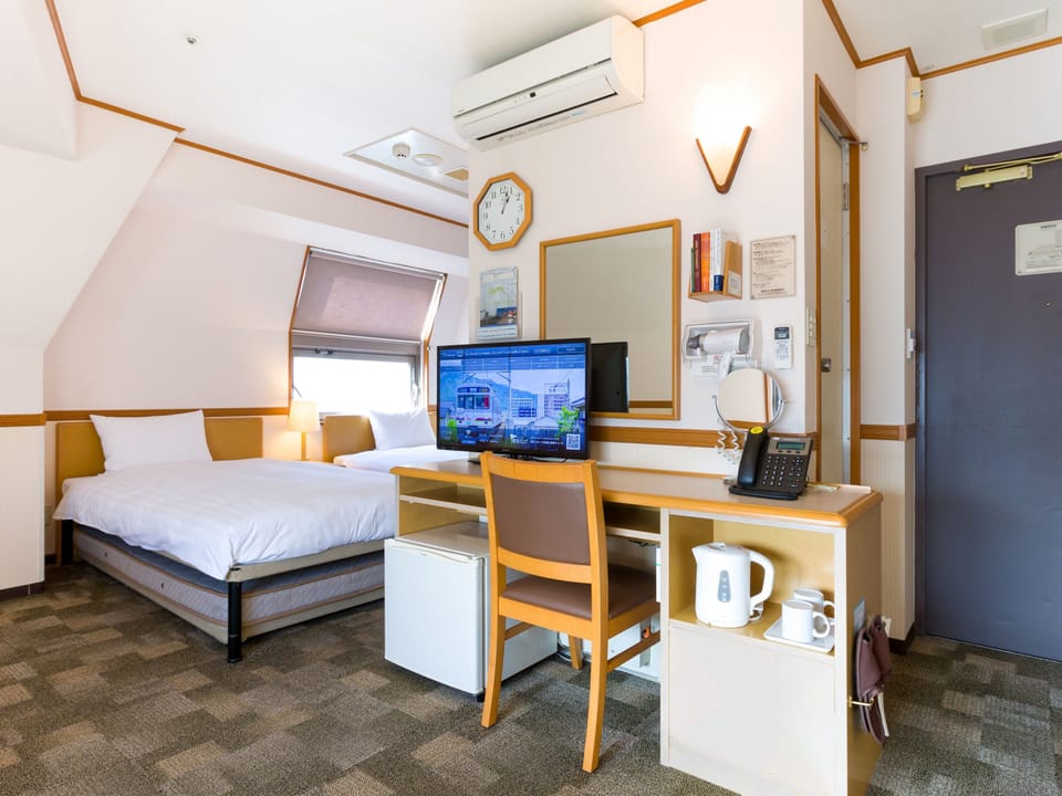 Deluxe Twin Room, Non Smoking | Desk, blackout drapes, iron/ironing board, free WiFi