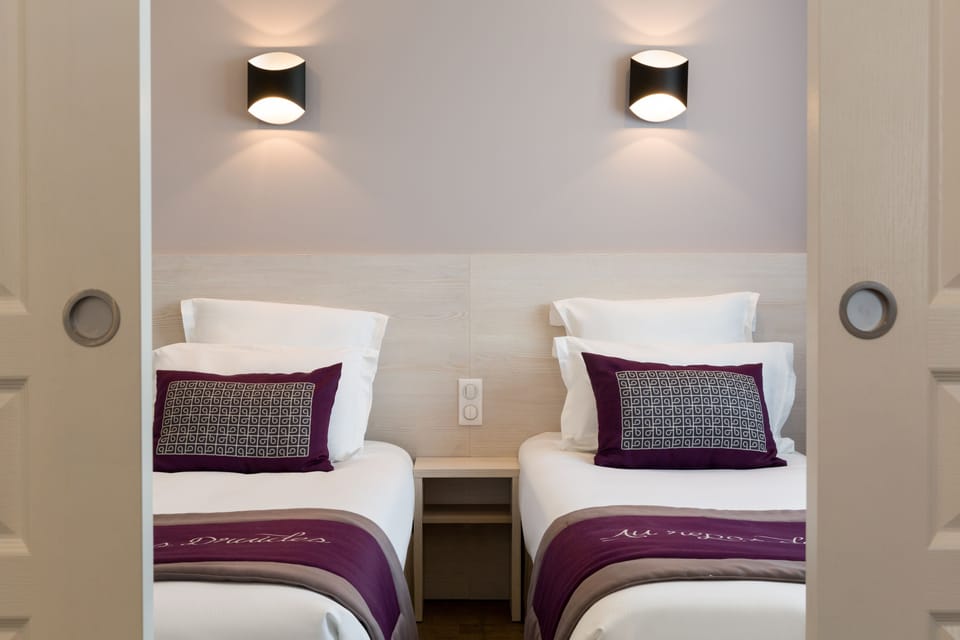 Family Quadruple Room | Minibar, desk, soundproofing, iron/ironing board
